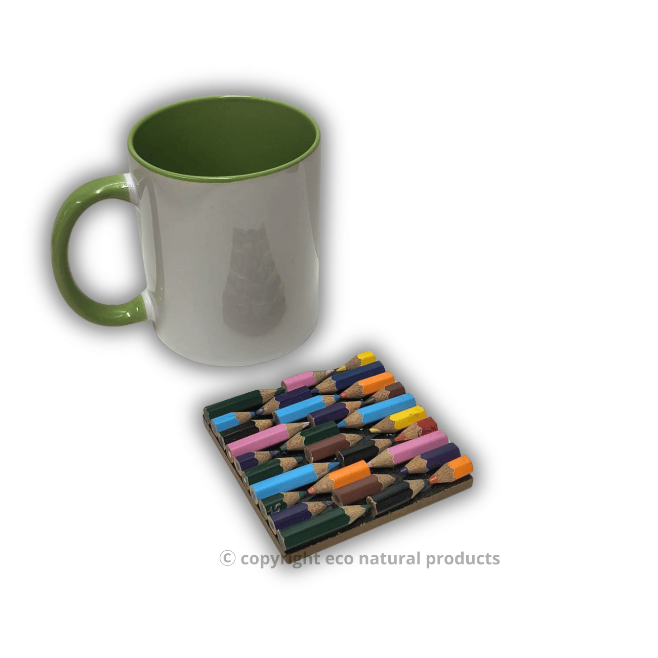Green mug and colorful pencil-shaped coasters on a white background
