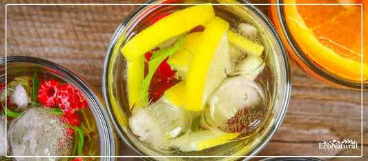 Infused detox water with lemon, berries and orange slices