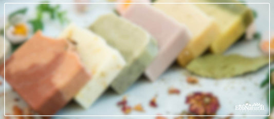 Natural handmade soap bars beside supermarket soap