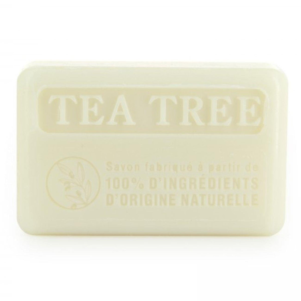 Close-up of 100% natural Savon de Marseille tea tree soap bar, showcasing its embossed 'TEA TREE' label and eco-friendly ingredients.