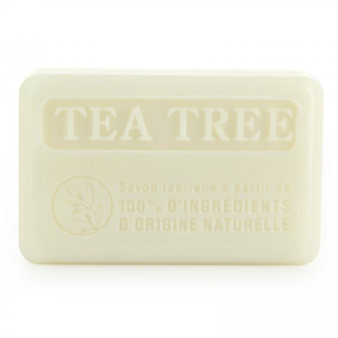 Close-up of 100% natural Savon de Marseille tea tree soap bar, showcasing its embossed 'TEA TREE' label and eco-friendly ingredients.