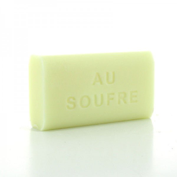 Plain Marseille soap bar embossed “AU SOUFRE” on white background