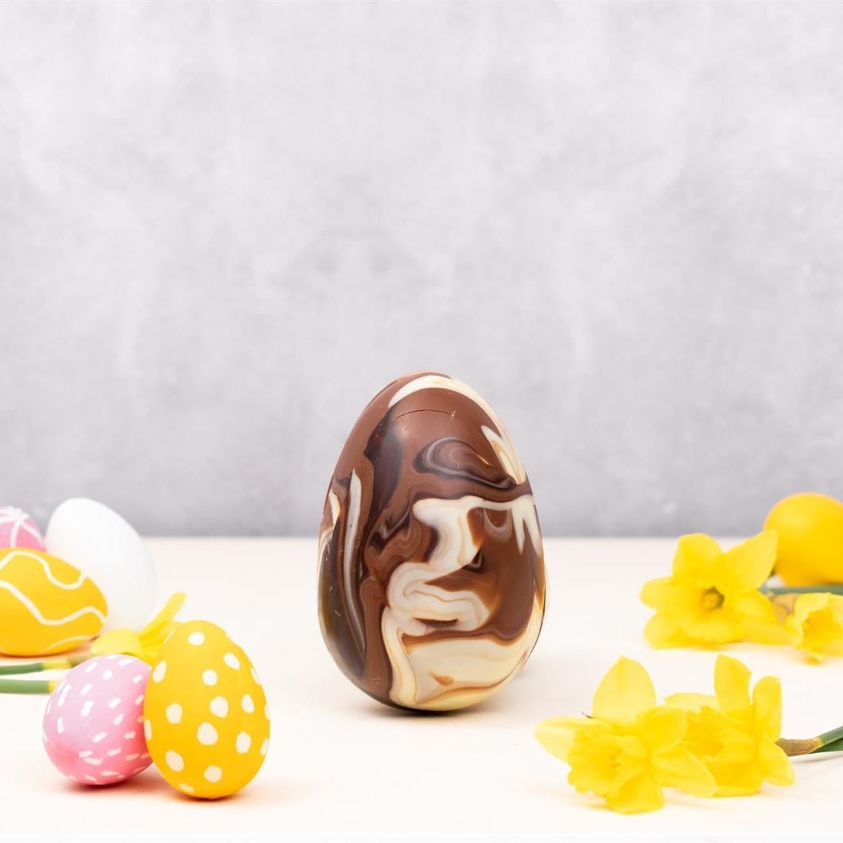 Cocoa Loco Organic Marbled Chocolate-filled with Milk Buttons Easter Egg 225g lifestyle image