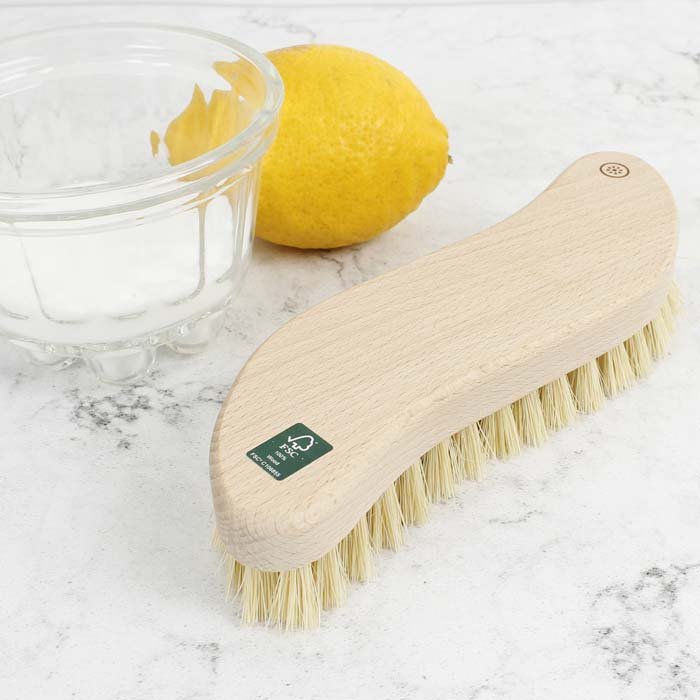 A Slice of Green Wooden Scrubbing Brush — in use