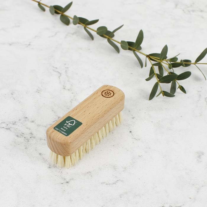 A Slice of Green Wooden Nailbrush — in use cleaning nails