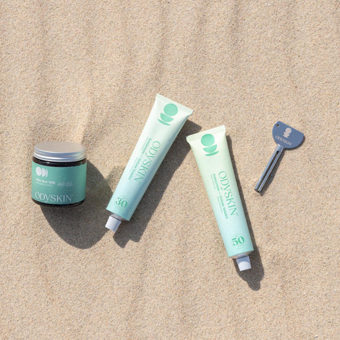 Beach-ready flat lay with Odyskin SPF30 sunscreen