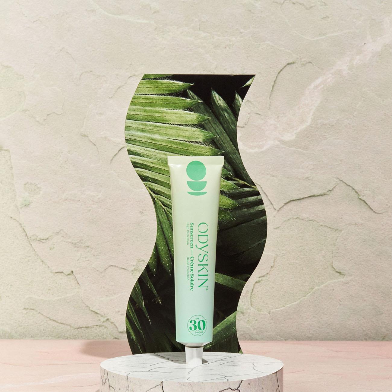 Odyskin SPF30 Natural Sunscreen tube lifestyle image